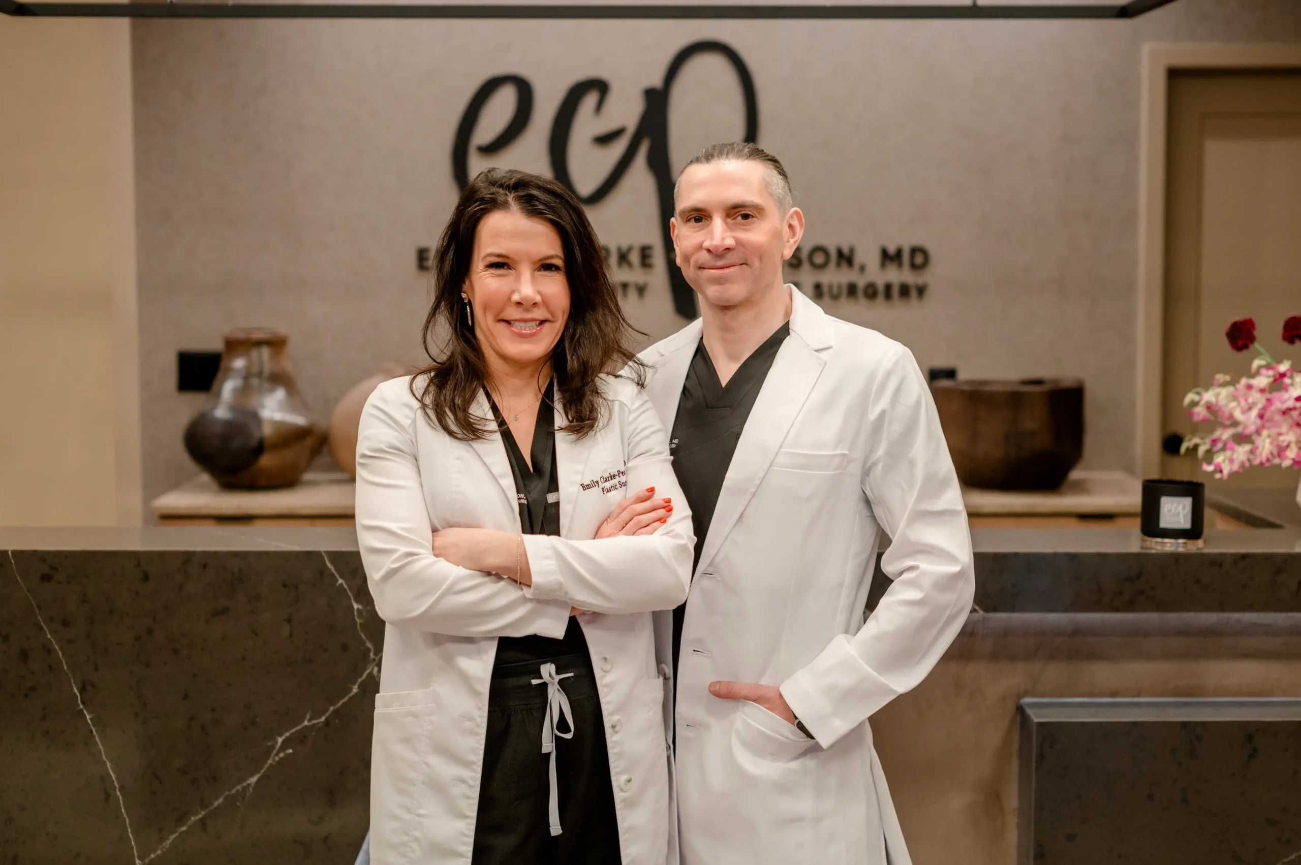 Dr. Emily Clarke-Pearson and Dr. Emile Brown, board-certified plastic surgeons, at Charm City Plastic Surgery in Baltimore